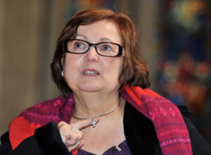 Former British Airways employee Nadia Eweida, stands in Temple Church after a press conference announcing that the European Court of Human Rights ruled in her favour in her case against BA which made her stop wearing her cross visibly.