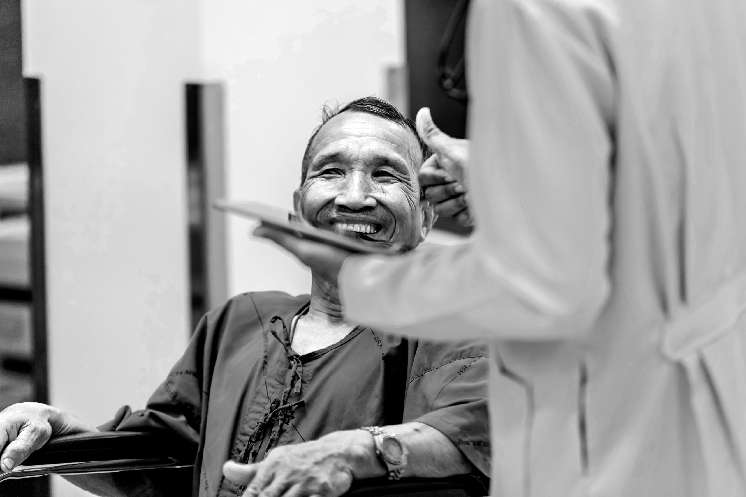 Patient talking to a doctor at hospital.